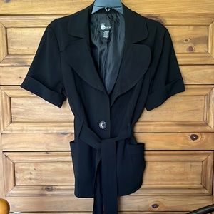 Black Large First Option short sleeved dress jacket with belt and pockets.